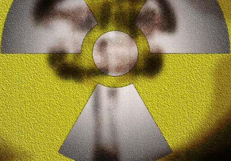 A nuclear symbol on a yellow background